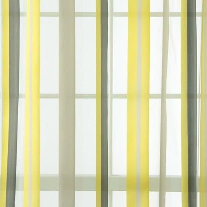 Yellow, gray, and off-white striped sheer curtains framing a window.