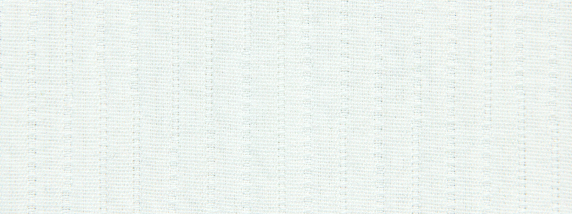 White textured fabric with subtle vertical pinstripes and dotted weave pattern.