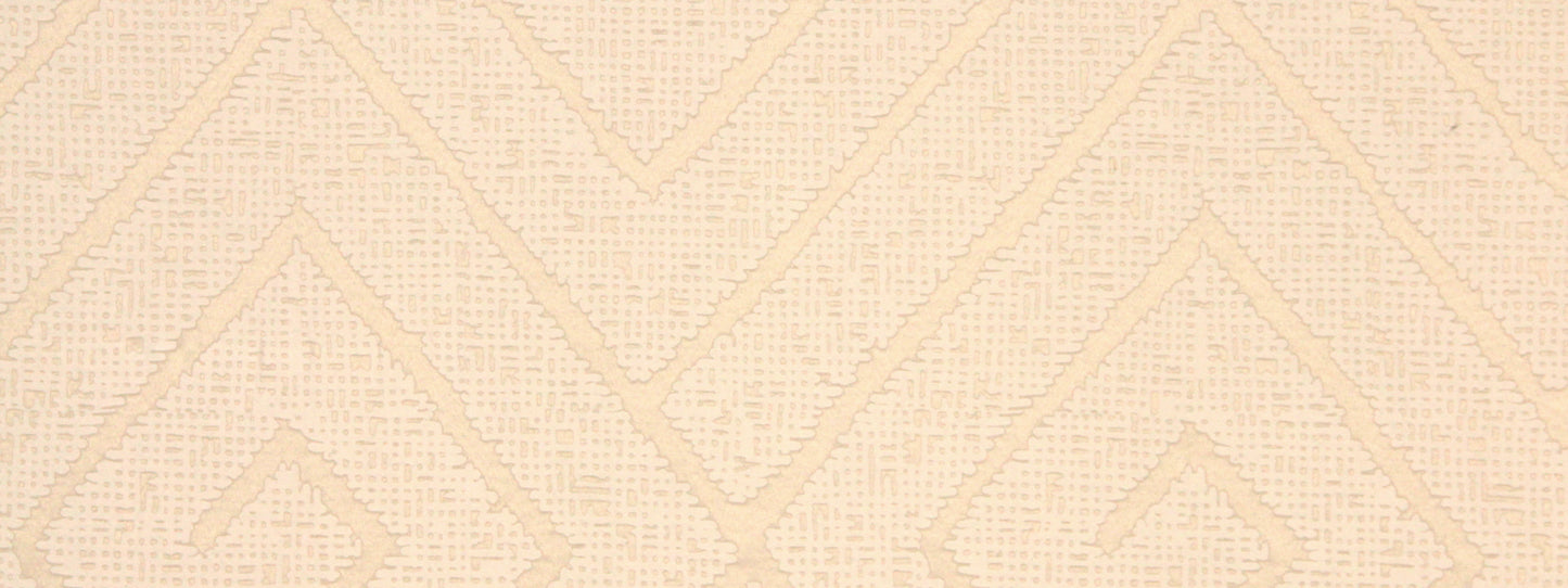 Beige textured fabric with raised chevron diamond geometric pattern for a soft, neutral look.