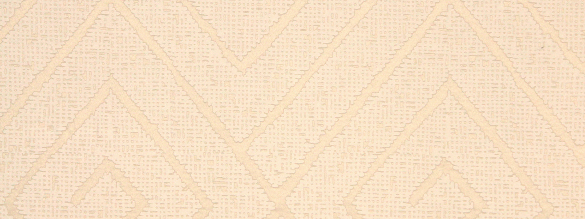 Beige textured fabric with raised chevron diamond geometric pattern for a soft, neutral look.
