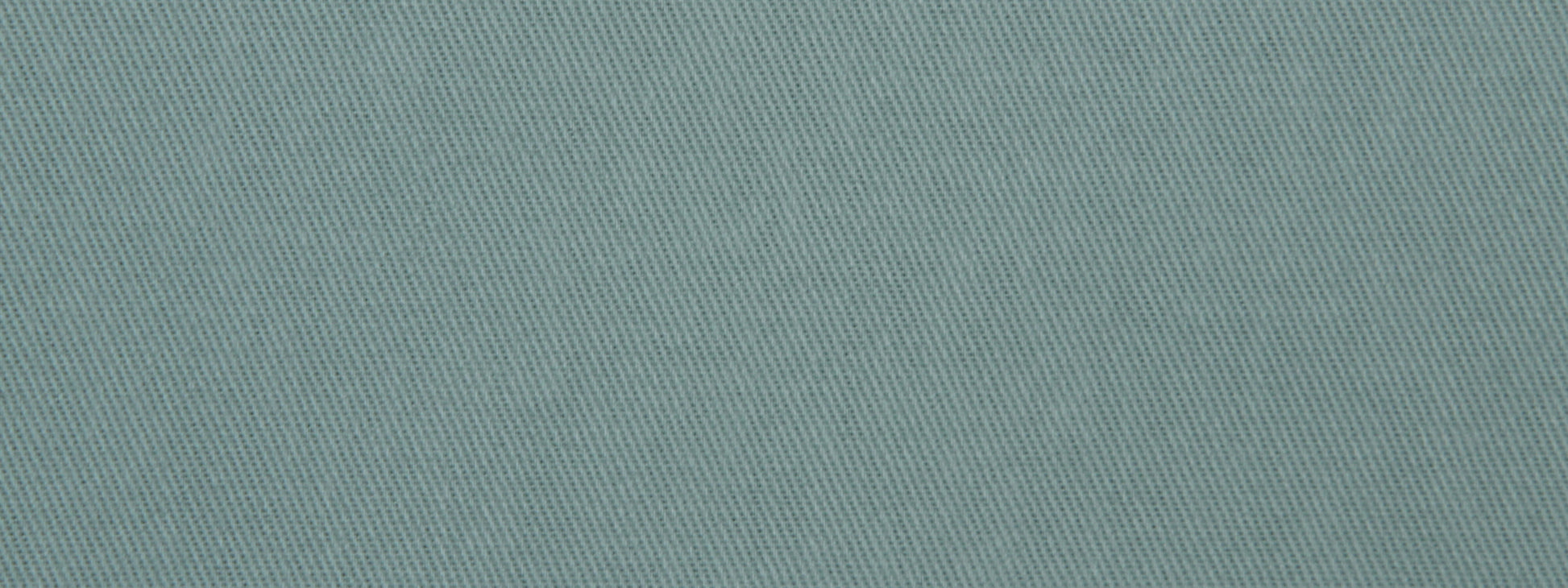 Teal-blue denim-like twill fabric close-up with diagonal weave texture.