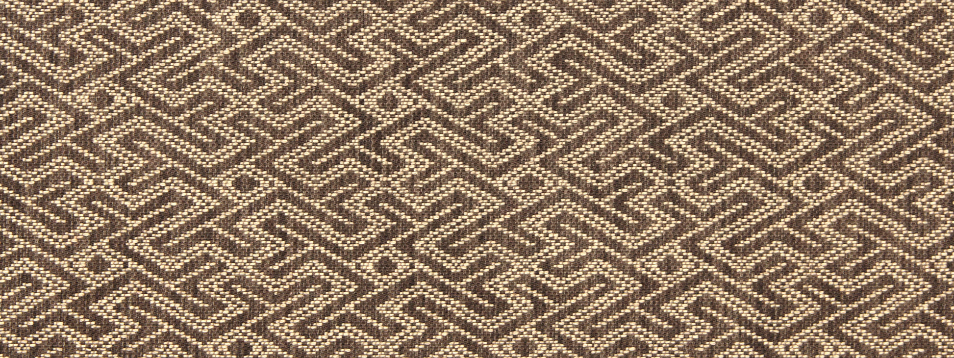 Brown and cream woven upholstery fabric with a repeating interlocking geometric maze/chevron pattern.