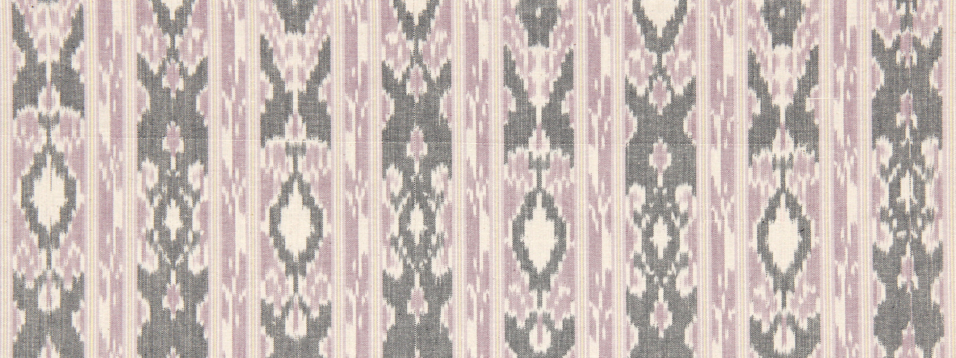 Ikat-inspired fabric in pink, gray and cream with vertical diamond motifs; decorative textile for drapes or cushions.