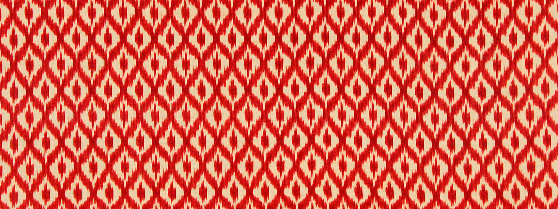 Red and white ikat-inspired geometric diamond pattern fabric.