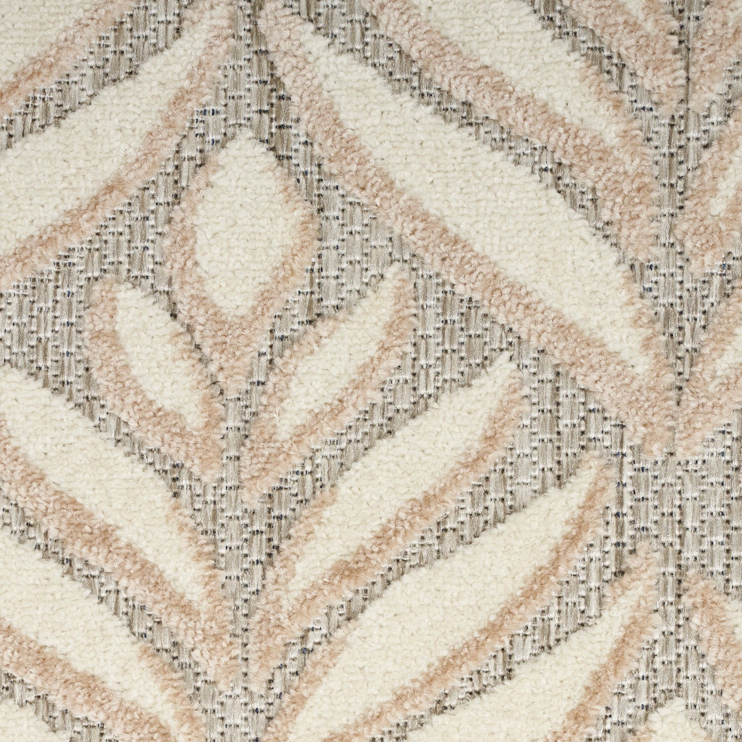 Cream & beige shag rug with geometric chevron & diamond pattern and soft tufted pile.