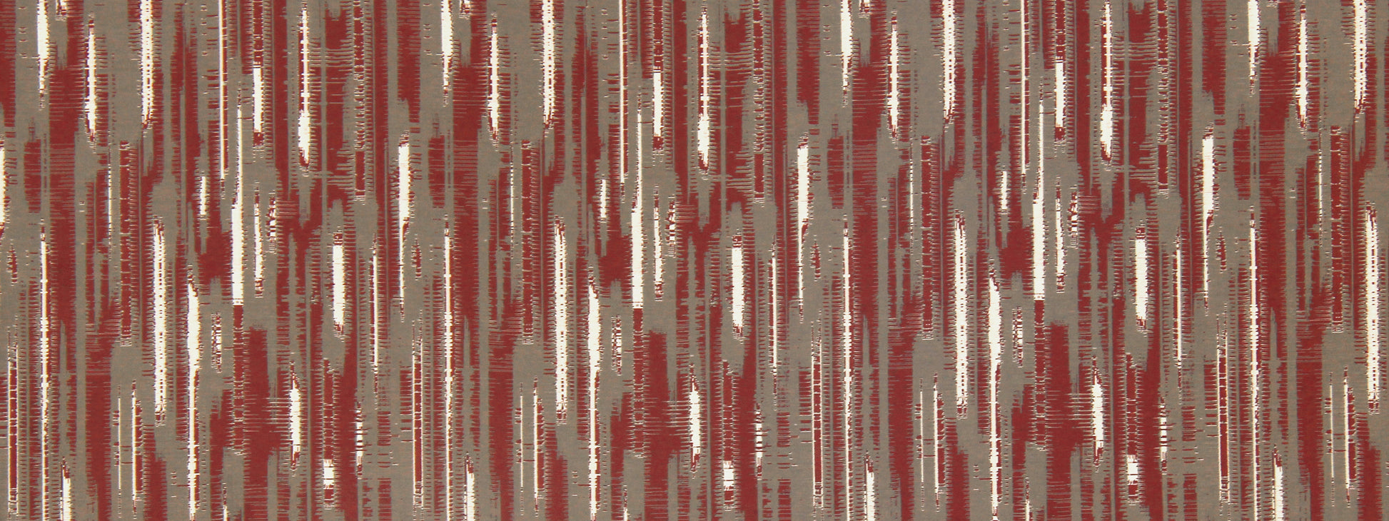 Red, ivory and gray ikat-style wallcovering with irregular vertical brushstrokes.