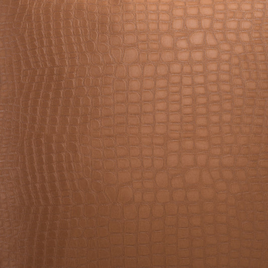 Brown crocodile-embossed leather texture close-up.