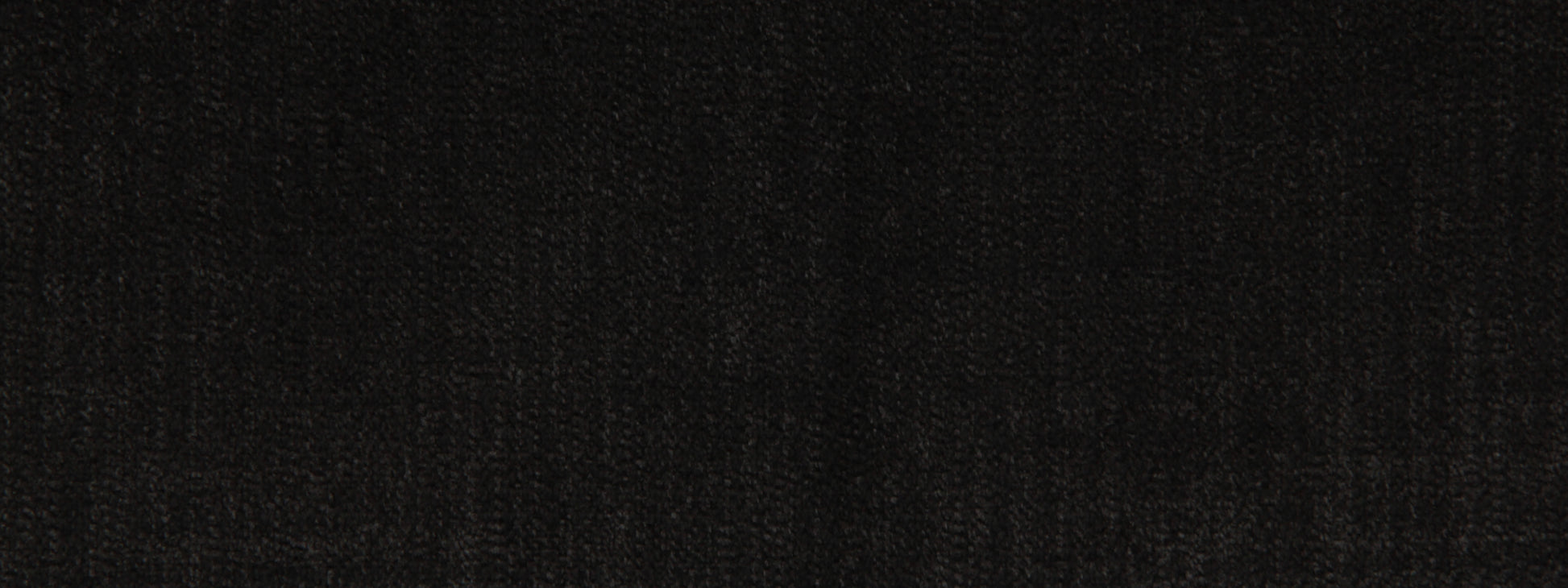 Close-up of black woven upholstery fabric texture with a matte finish.