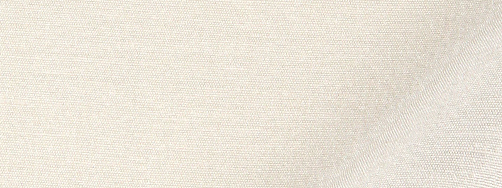 Beige silk drapery fabric close-up showing a woven texture and visible threads.
