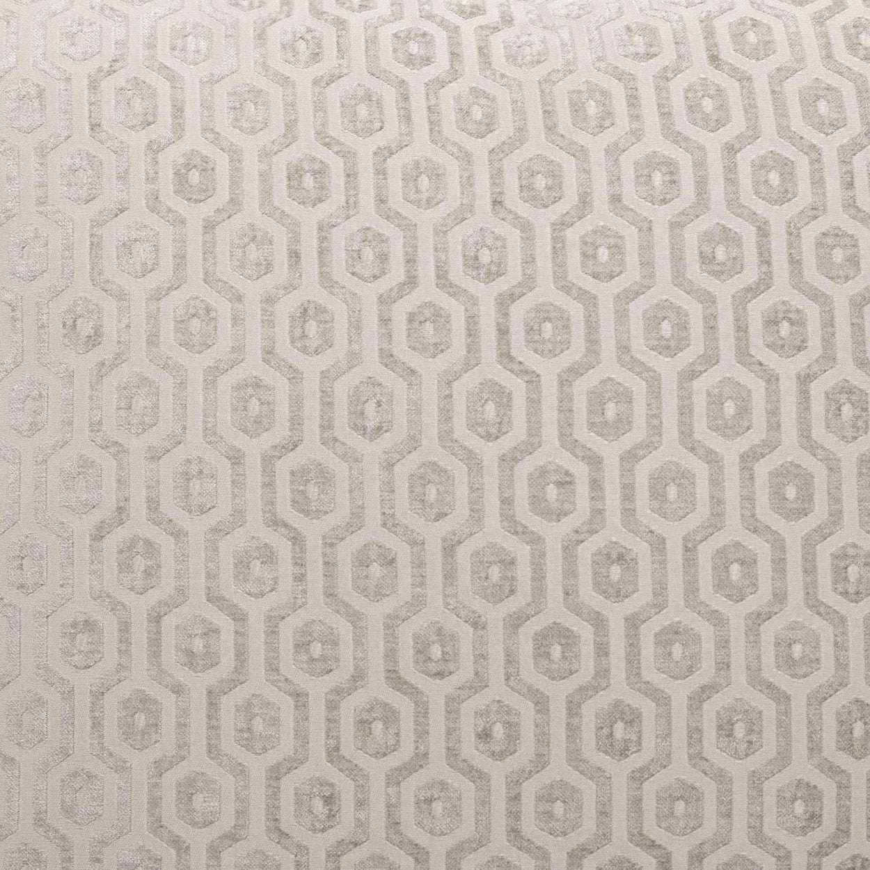 Grey geometric pillow with an interlocking octagon lattice pattern and subtle woven texture.