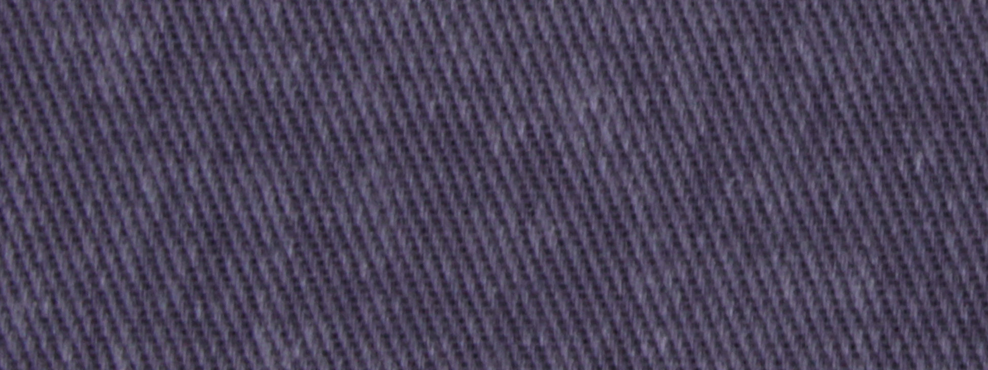 Close-up of cobalt upholstery fabric with diagonal twill texture.