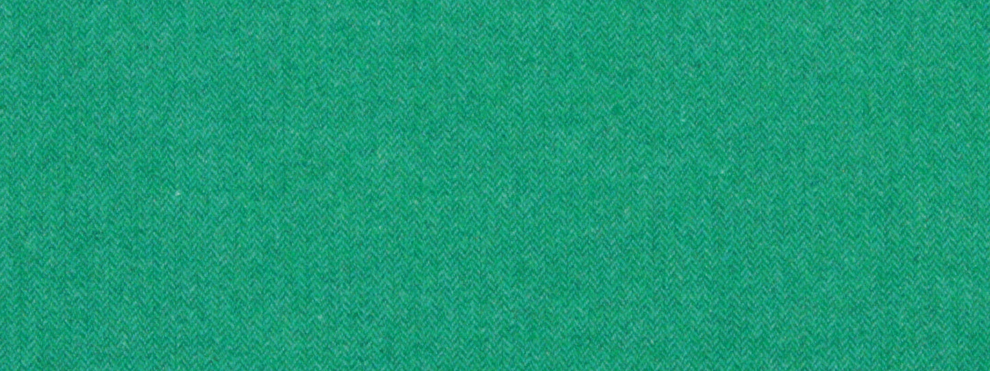 Bright green textured fabric close-up with fine weave.