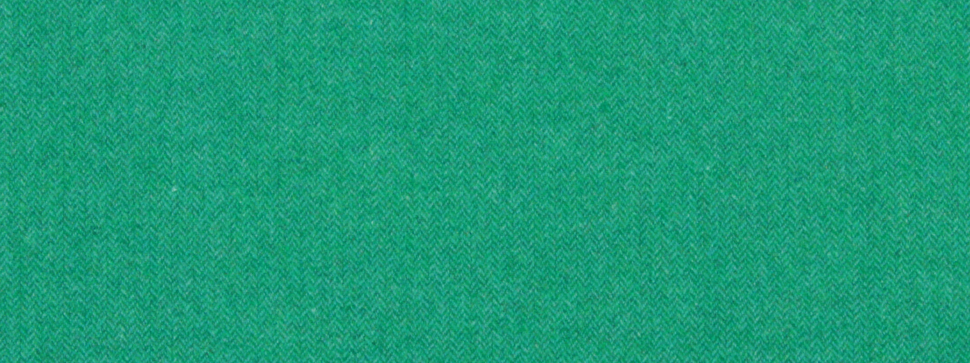 Bright green textured fabric close-up with fine weave.