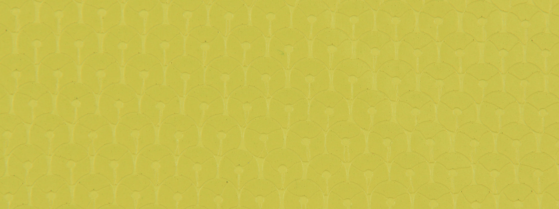 Chartreuse upholstery fabric with a shimmering sequin pattern and a repeating geometric texture.