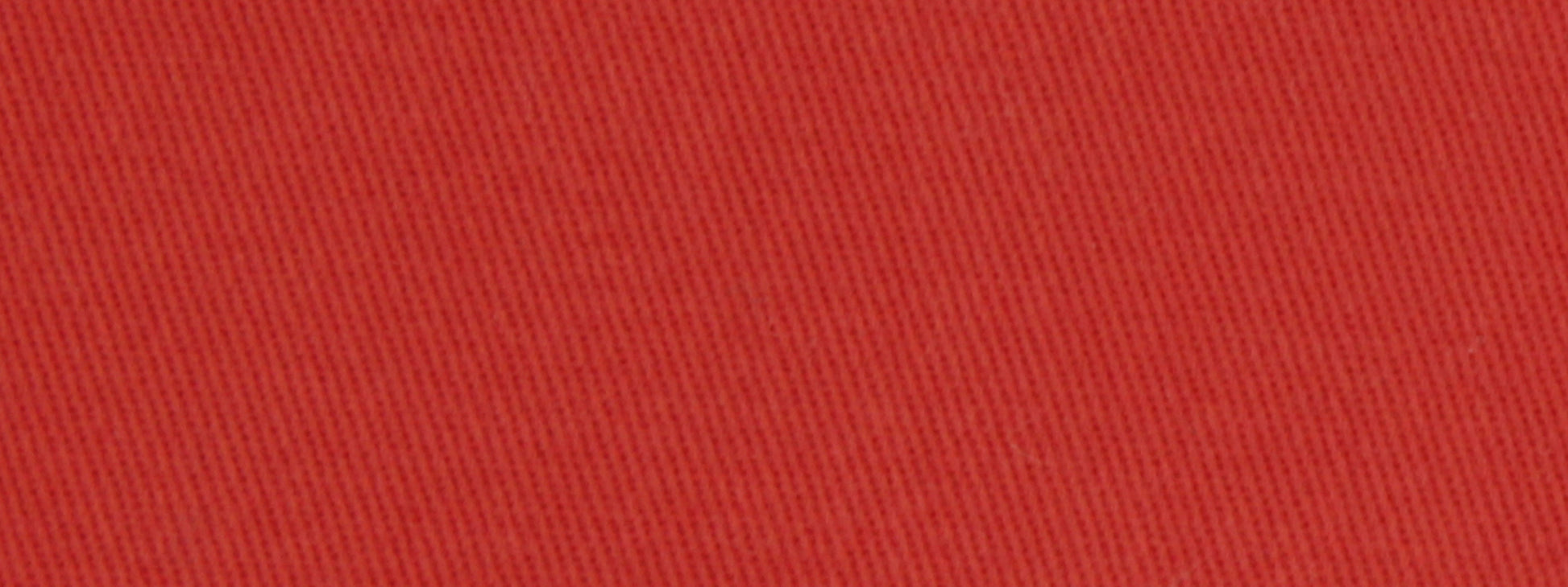 Close-up of red cotton twill fabric texture with diagonal weave and scarlet color, upholstery fabric.