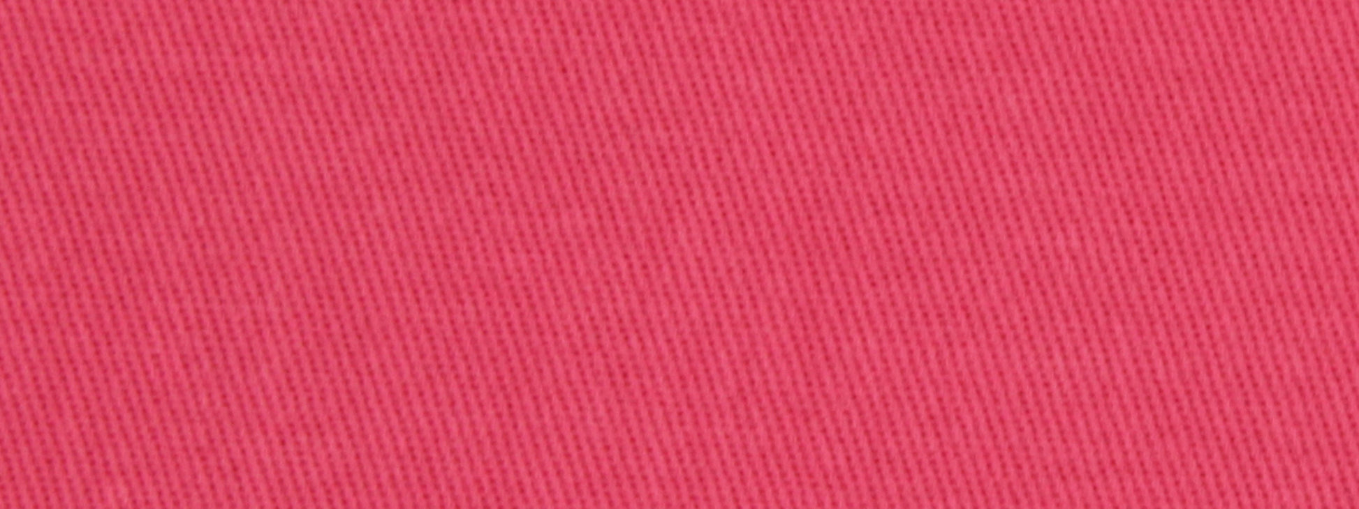 Close-up of bright pink cotton twill upholstery fabric with a diagonal weave.