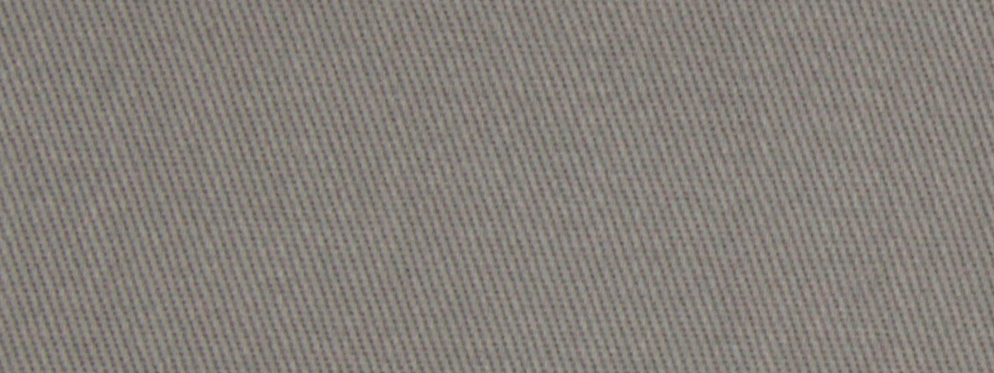 Close-up of light gray twill fabric texture with diagonal weave, a durable woven textile.