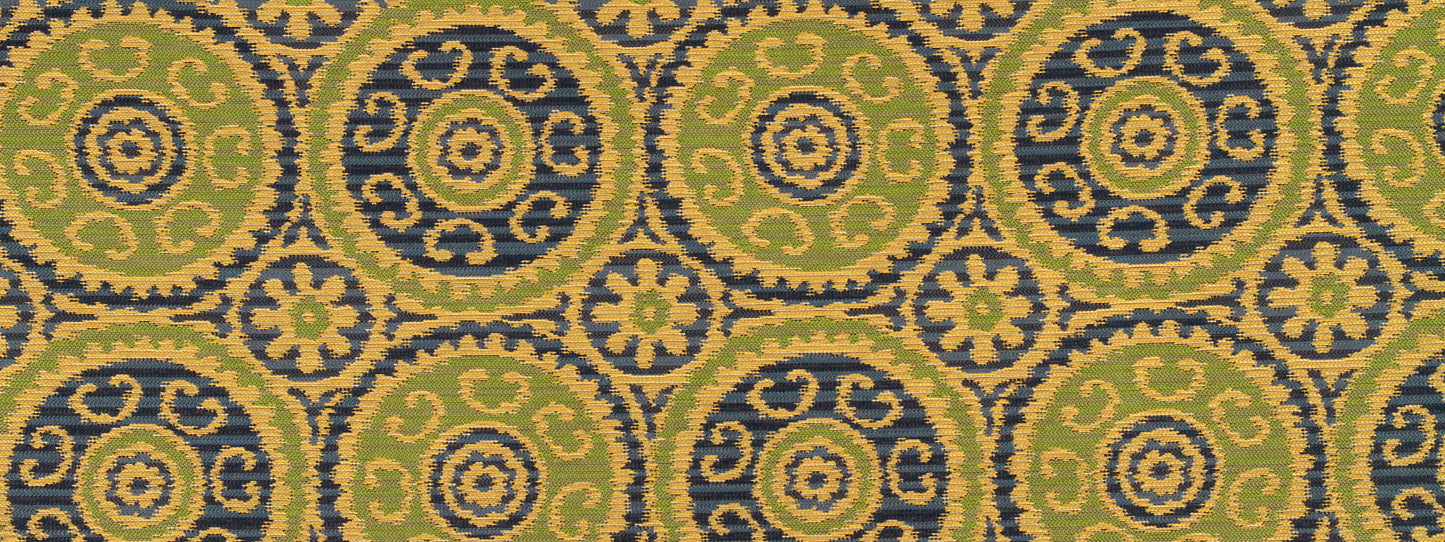 Mustard-yellow fabric with repeating green and navy circular medallions outlined in gold; ornate upholstery textile.
