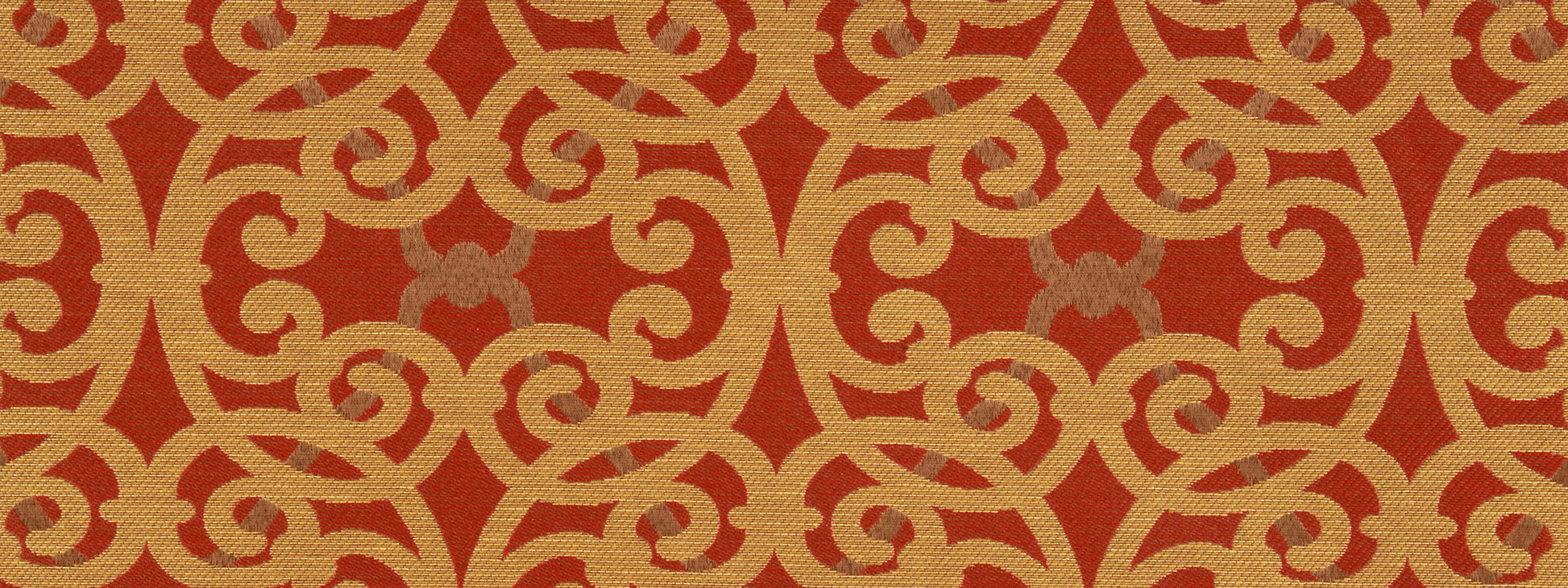 Red backdrop with gold damask scrollwork pattern; ornate repeating arabesque motif suitable for upholstery fabric.