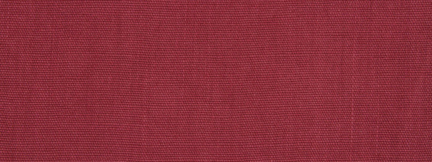 Close-up of raspberry upholstery fabric texture with fine woven fibers.