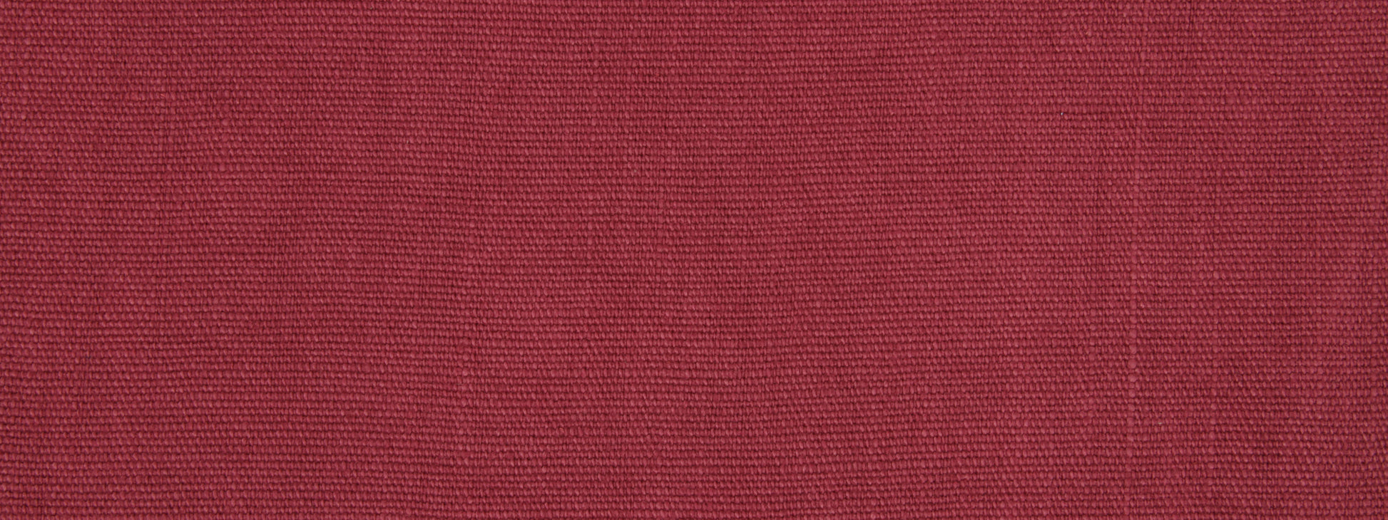 Close-up of raspberry upholstery fabric texture with fine woven fibers.