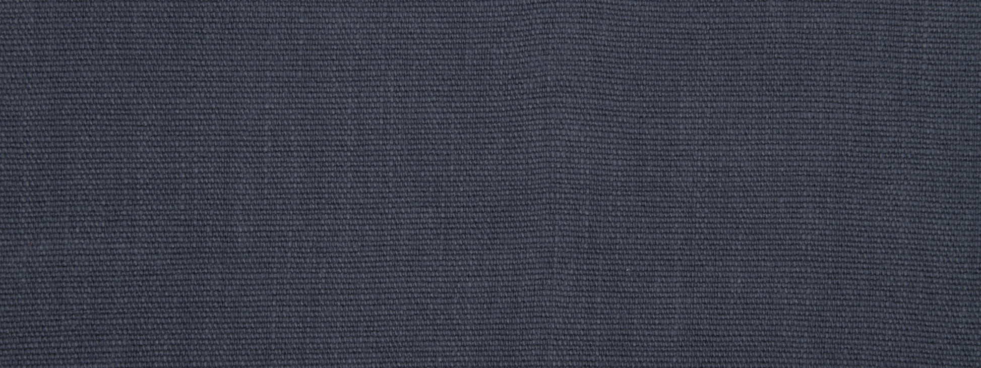 Close-up of dark navy blue woven fabric texture with visible fibers.