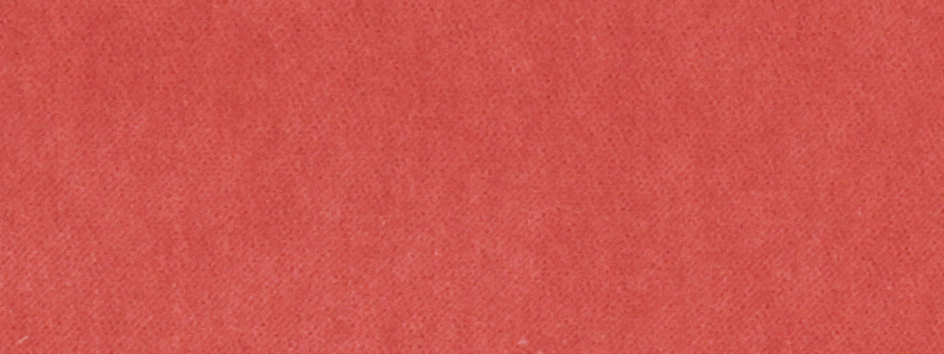 Red-orange woven upholstery fabric close-up with a soft matte texture.