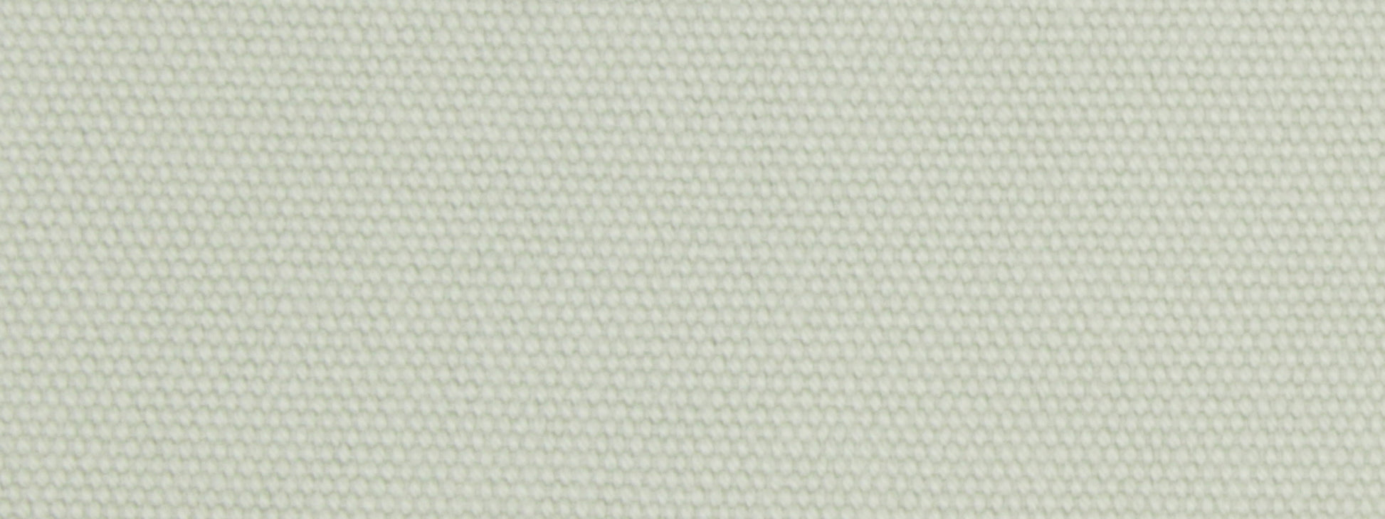 Close-up of mint green woven upholstery fabric with a tiny dot texture; linen-like textile.