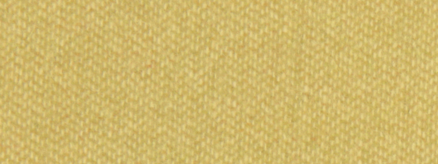 Close-up of chartreuse wool upholstery fabric with a tight weave; warm yellow-green fibers create a rich woven texture.