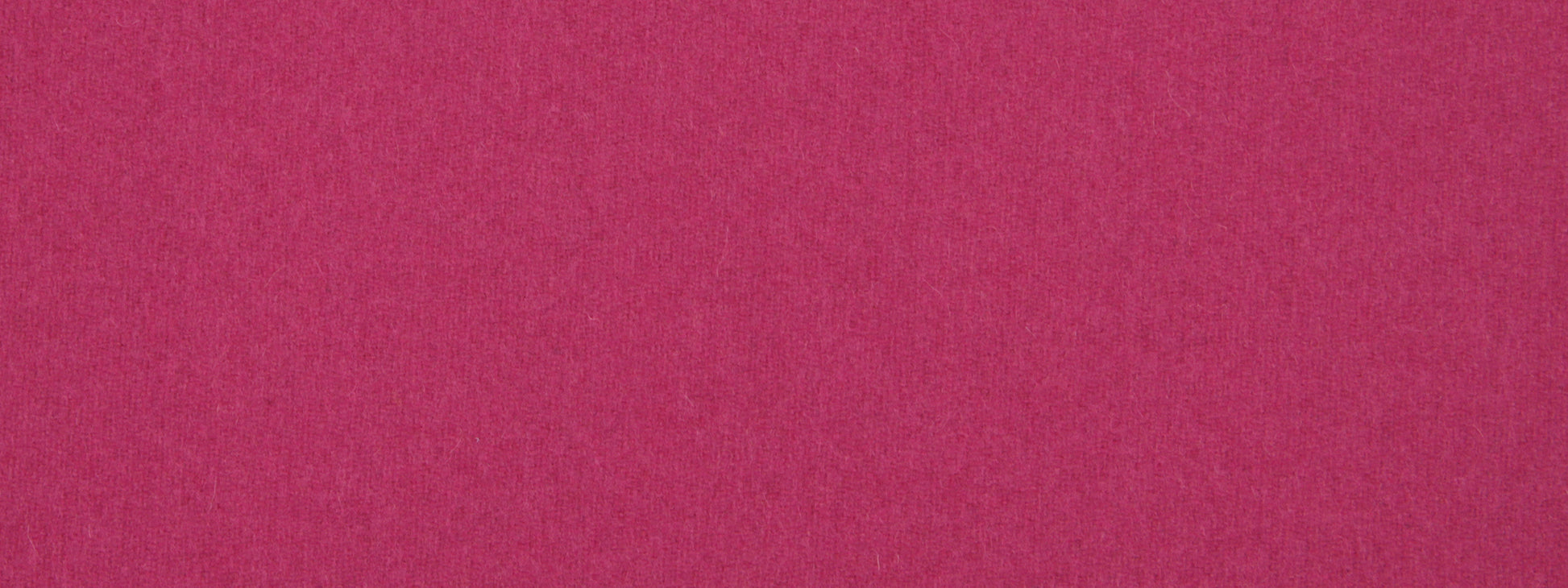 Close-up magenta fabric texture with visible fibers.