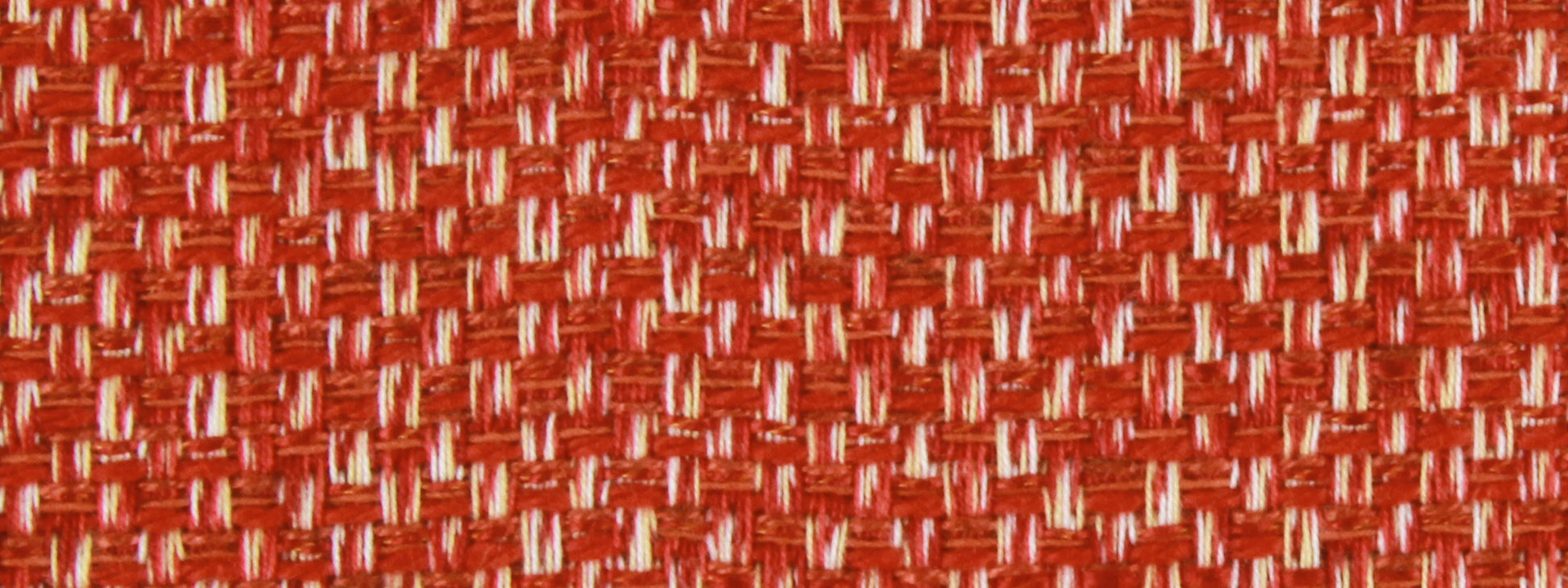 Close-up red woven fabric with white threads, textured textile pattern.