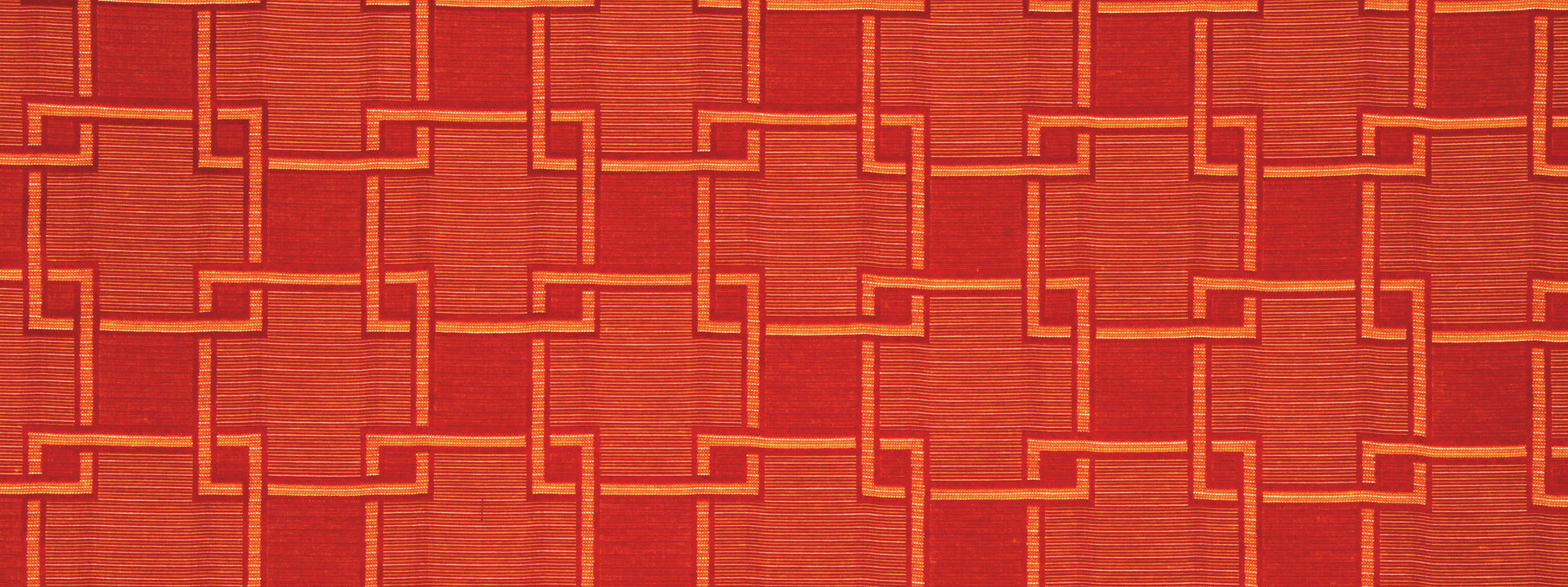 Orange woven fabric with interlocking square-link pattern; bold, warm geometric texture.