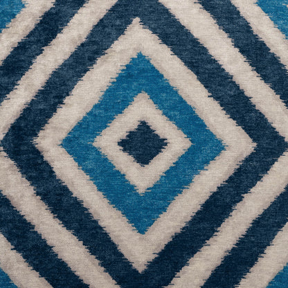 Geometric diamond-pattern pillow in teal, navy and cream; 24" x 24" square, woven textile.