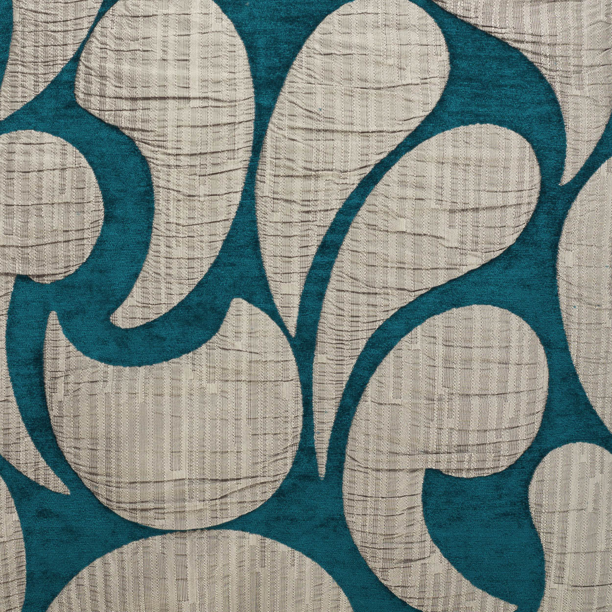 Teal background with beige abstract leaf motifs; textured woven fabric pattern.