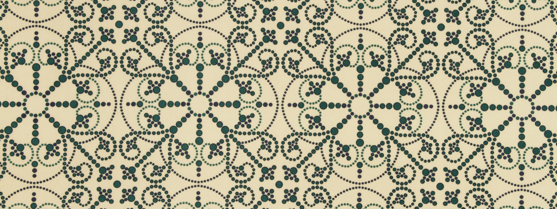 Beige fabric with a teal dotted pattern.