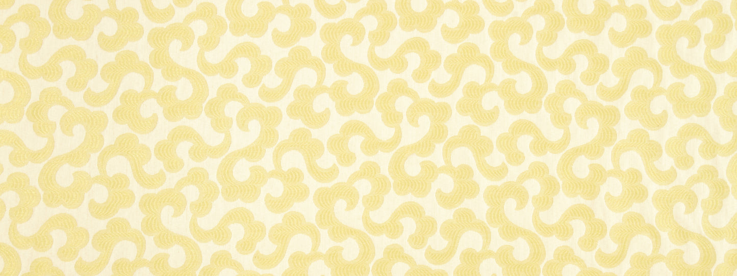 Cream fabric with a pale yellow damask pattern in repeating scroll motifs.