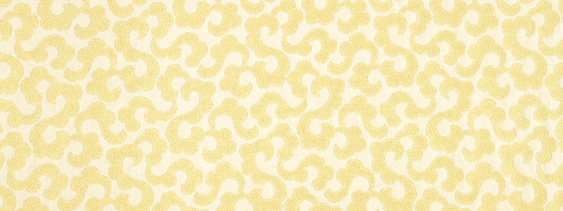 Cream fabric with a pale yellow damask pattern in repeating scroll motifs.