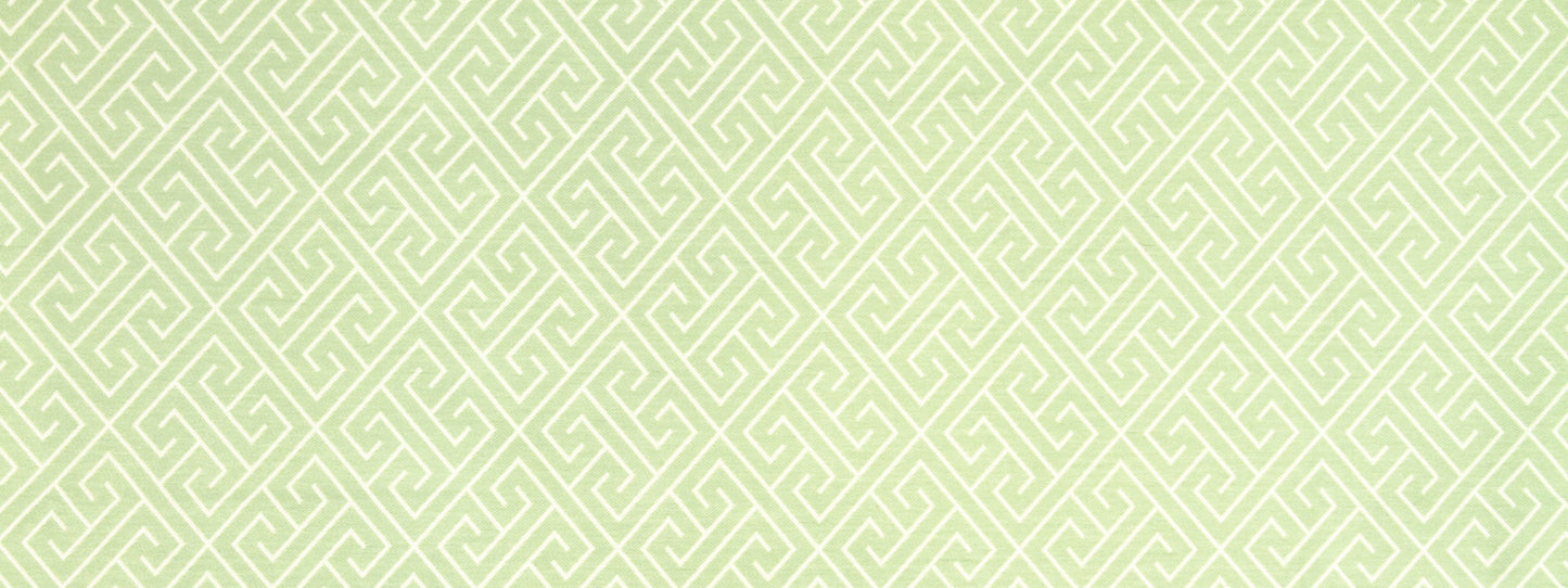 Pale lime-green Greek-key geometric upholstery fabric.