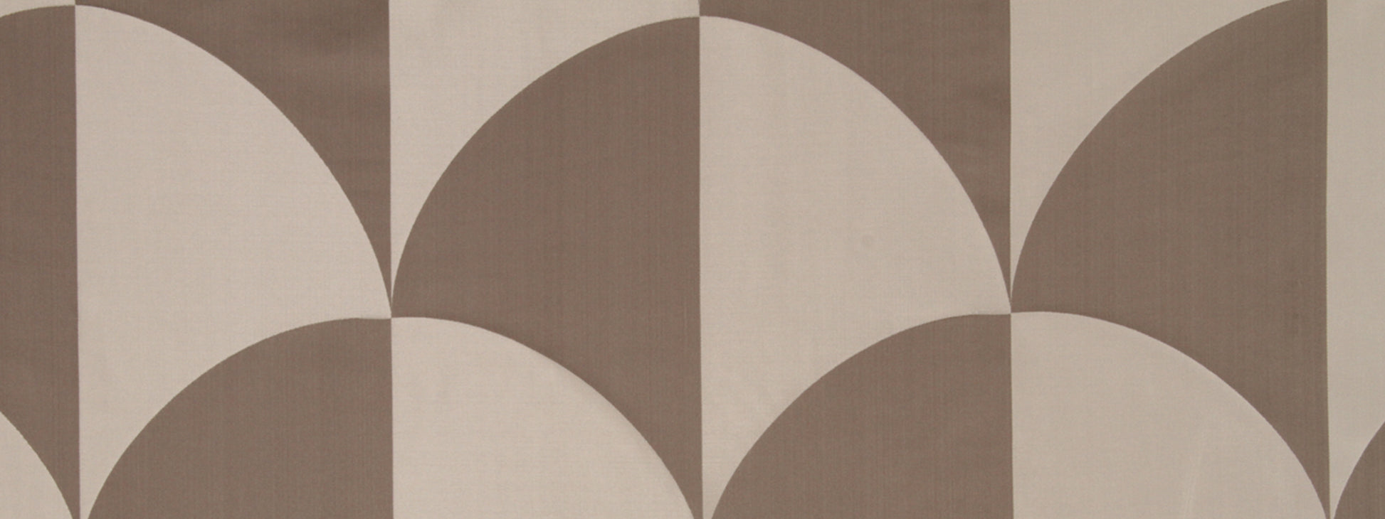 Geometric brown and beige fabric pattern with overlapping semicircles creating petal shapes in taupe and cream.