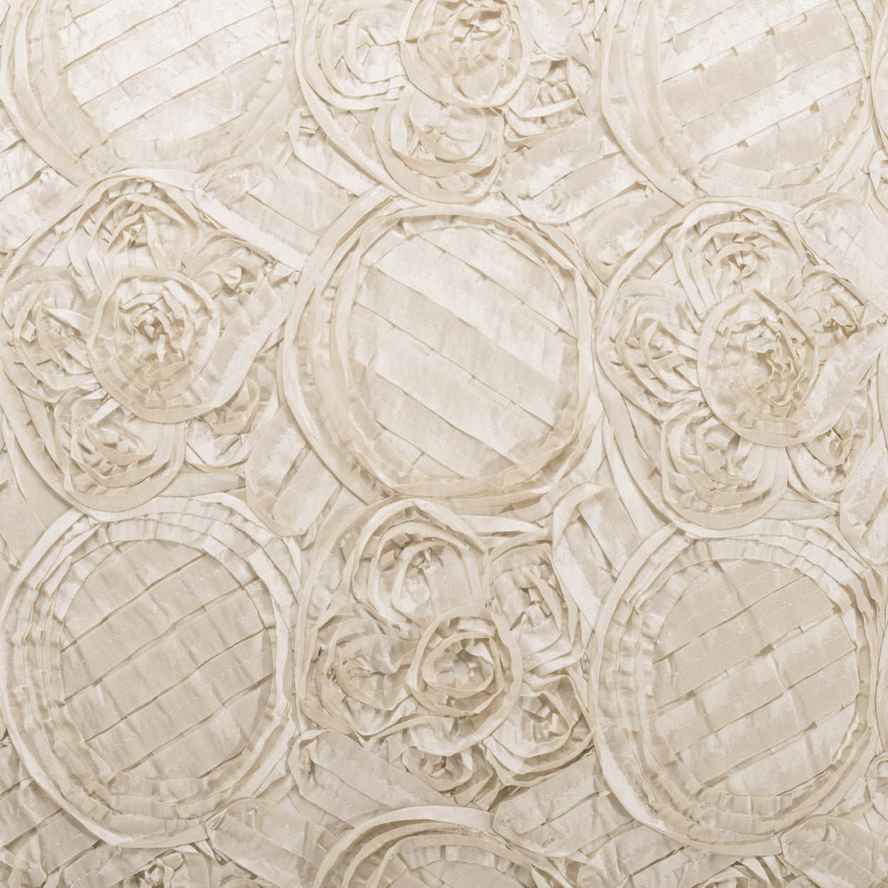 Beige fabric with embossed circular rosette patterns and quilted lines, soft neutral texture.