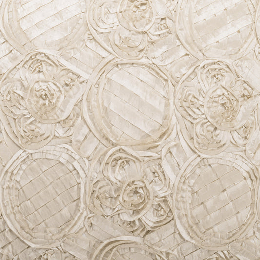 Beige quilted fabric with embossed circular rosette patterns and striped texture.