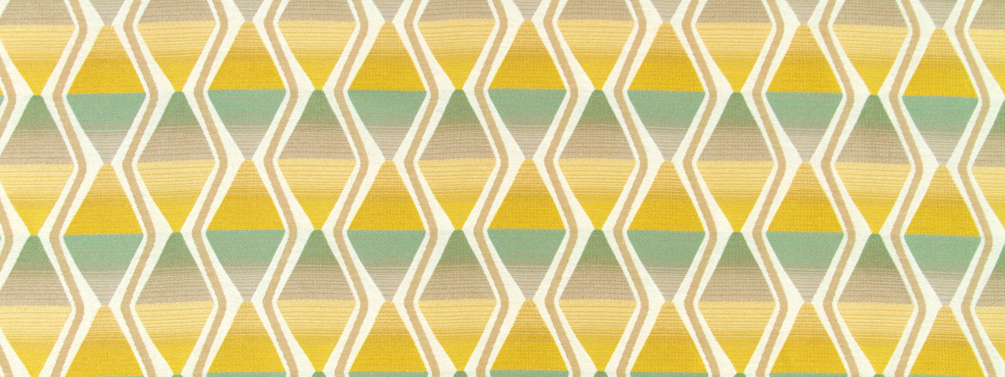 Geometric diamond lattice pattern in yellow, green and beige tones on upholstery fabric.
