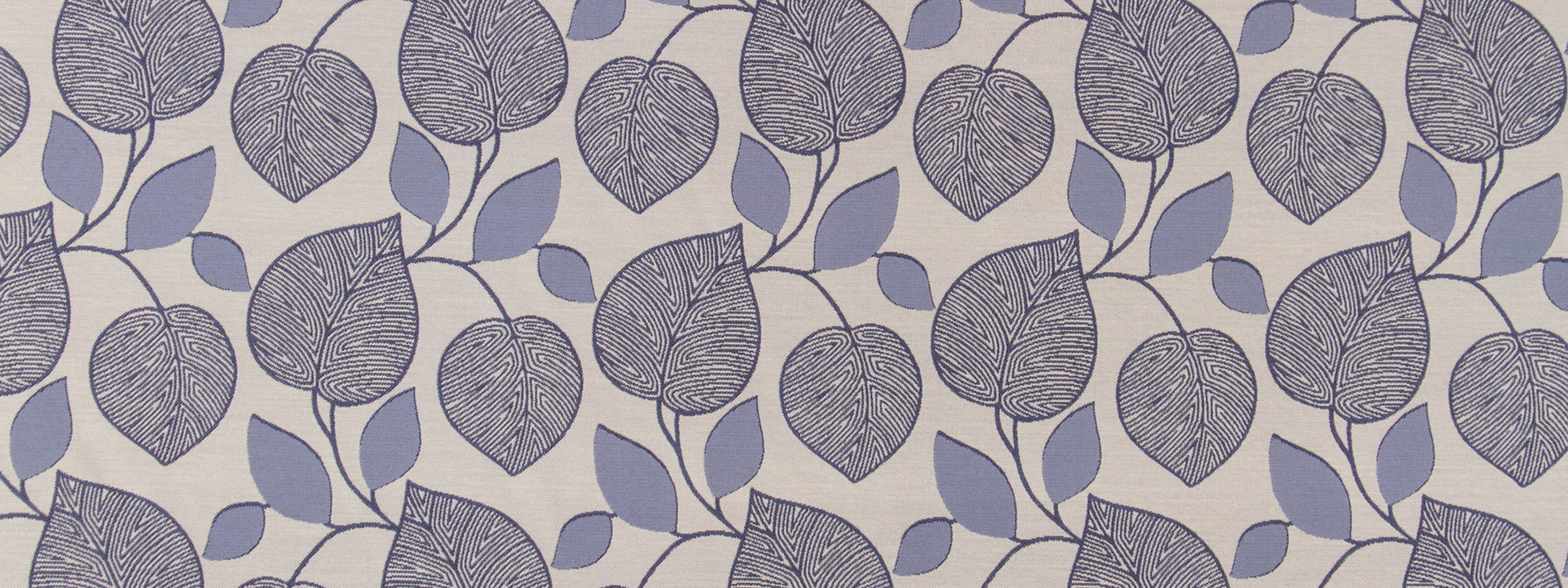 Botanical leaf-pattern upholstery fabric with lavender and bluish leaves on beige background; repeating vine motif.