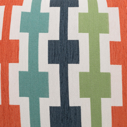 Woven fabric with vertical geometric cross motifs in orange, teal, navy, and lime green on white background.
