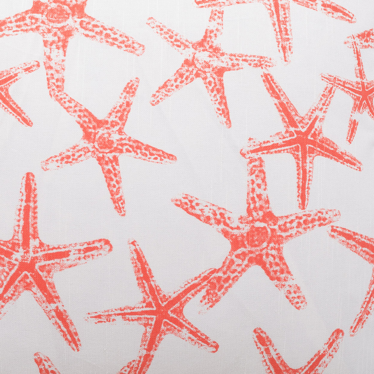 Orange starfish pattern on white fabric; coastal nautical textile.