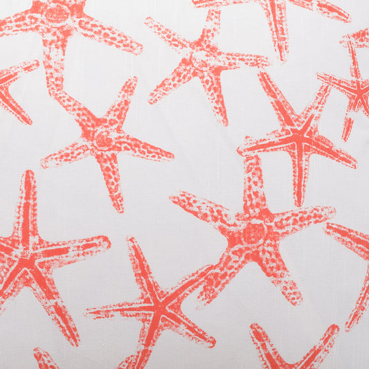 Orange starfish pattern on white fabric; coastal nautical textile.