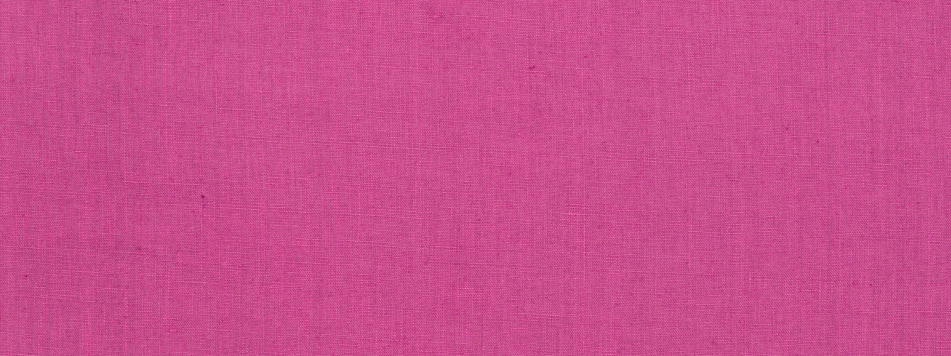 Raspberry solid fabric close-up with visible texture; versatile for garments or decor.