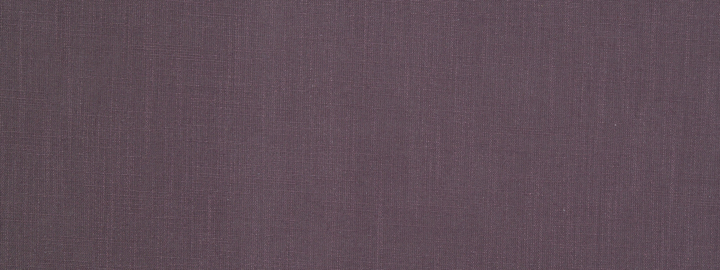 Close-up of muted plum-purple woven fabric texture with visible threads.