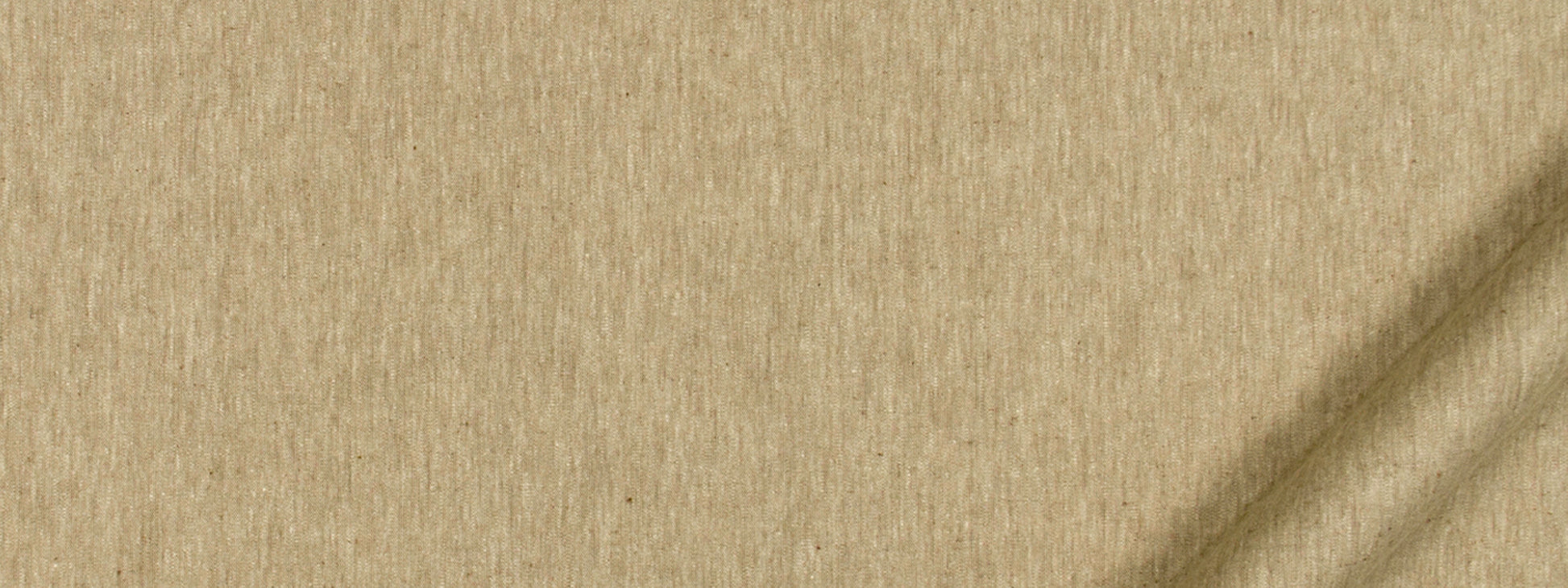 Beige textured fabric close-up with woven grain and subtle diagonal shadows.