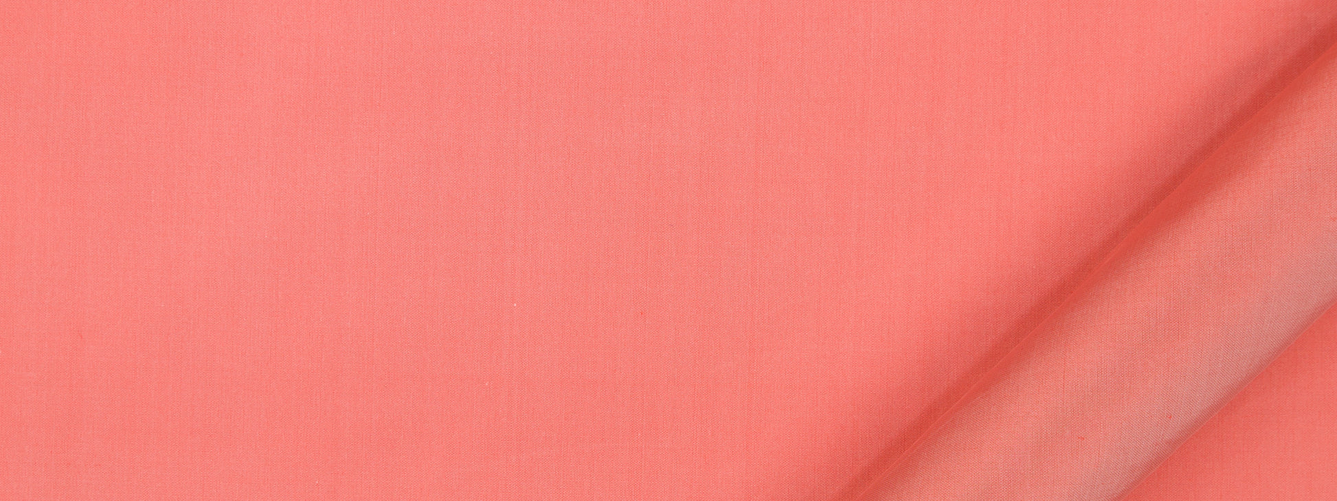 Coral pink fabric close-up with a diagonal crease and soft matte texture, ideal for clothing or crafts.